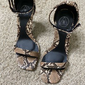 Square toe snakeskin pumps